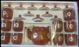 Juego de té chino rojo y dorado