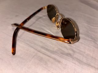 Gafas de sol Prada doradas y marrones