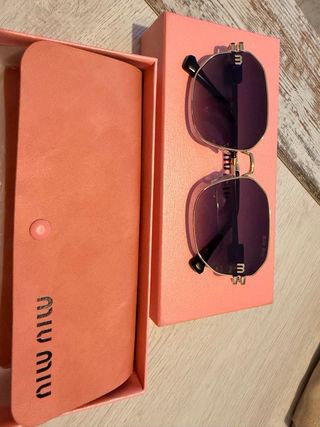 Gafas de sol Miu miu doradas