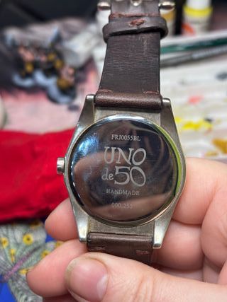 Reloj plata y cuero uno de 50