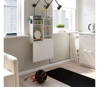 Mesa abatible pared con almacenaje. Blanco.