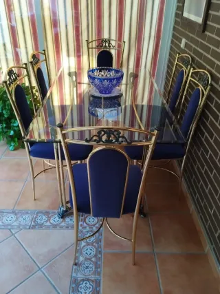 Mesa cristal y sillas comedor dorado