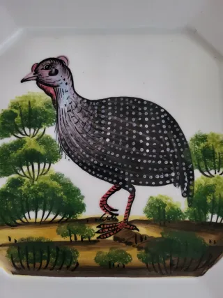 Piatto decorativo in ceramica con uccello