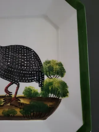 Piatto decorativo in ceramica con uccello