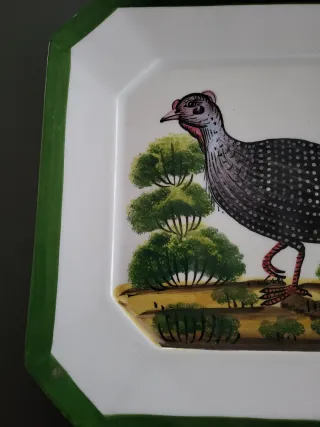 Piatto decorativo in ceramica con uccello