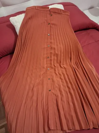 Falda plisada naranja caldera talla S o 36.
