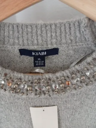 Jersey Kiabi gris adornos cuello Talla S