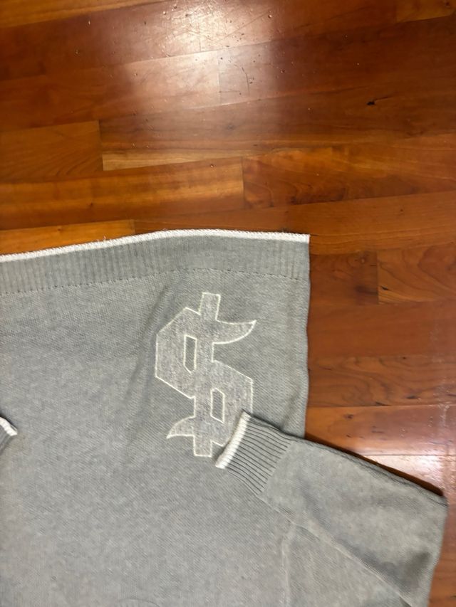 Felpa grigia con dollaro bianco