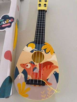 Ukelele infantil con diseño de dinosaurios