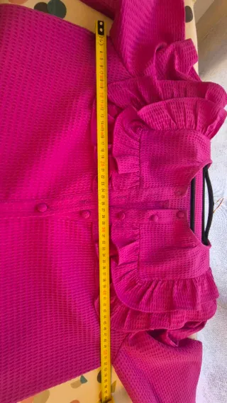 Blusa fucsia con volantes