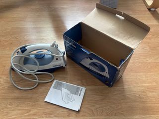 Plancha Taurus con caja e instrucciones