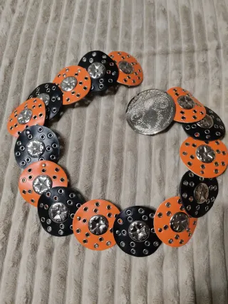 Cinturón con discos naranja y negro