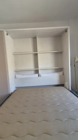 Cama abatible, sofá y armario. GlicerioChaves