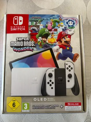 Nintendo Switch OLED + Super Mario Bros Wonder.
