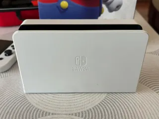 Nintendo Switch OLED + Super Mario Bros Wonder.