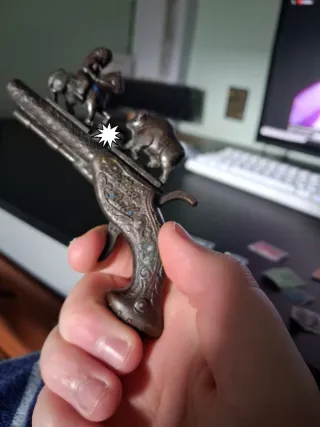 Pistola de juguete antigua "Sitting Bull" años 50