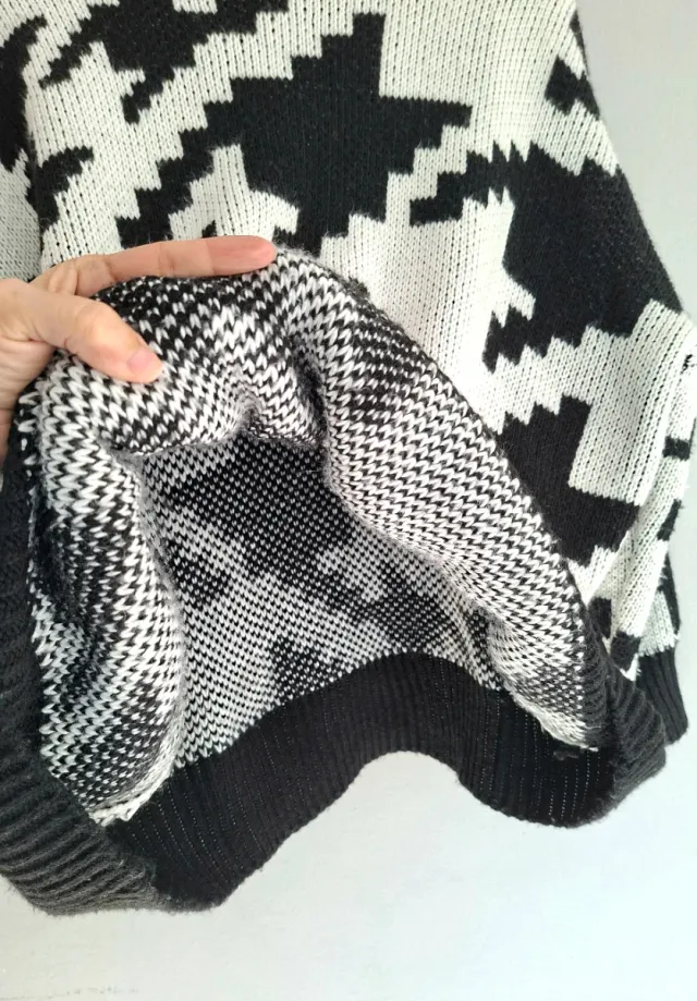 Jersey de punto mujer, oversize, con cuello alto.