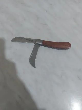 Coltello Stanley con lama seghettata