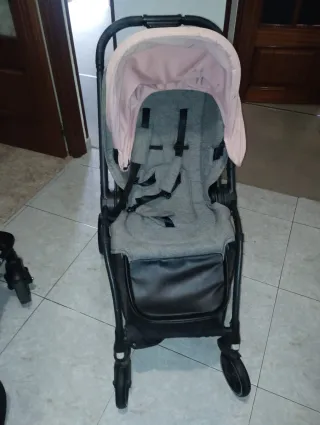 Carro de bebé gris y rosa