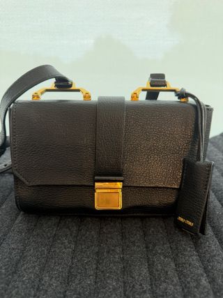 Borsa Miu Miu in pelle nera e dorata