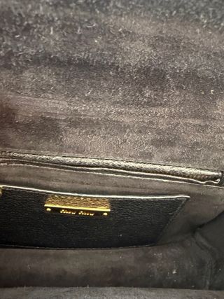 Borsa Miu Miu in pelle nera e dorata