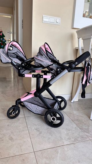 Cochecito de muñecas rosa y turquesa