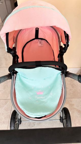 Cochecito de muñecas rosa y turquesa