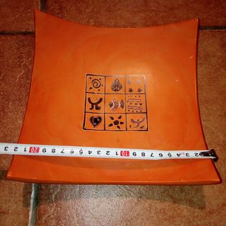 Plato decorativo de cerámica naranja