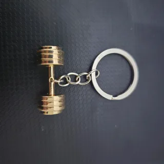 Llavero mancuerna dorada