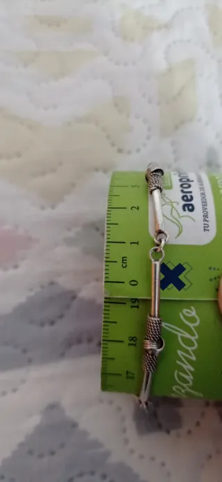 Pulsera étnica articulada, en plata.