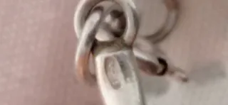 Pulsera étnica articulada, en plata.