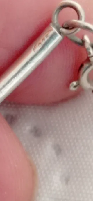 Pulsera étnica articulada, en plata.