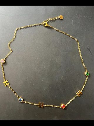 Pulsera de acero dorada con dijes