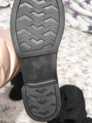 Botas altas negras con hebilla