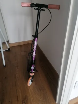 Patinete Oxelo MID5 morado y rosa. En Valladolid.