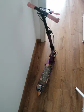 Patinete Oxelo MID5 morado y rosa. En Valladolid.