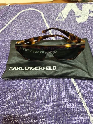 Gafas de sol Dior negras y doradas