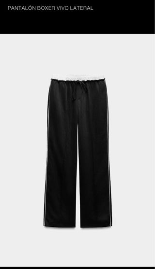 Pantalón negro con raya lateral blanca