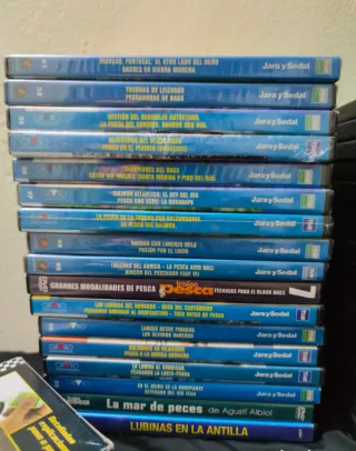 Lote de 34 dvd de pesca,mas 4 cinta vhs.