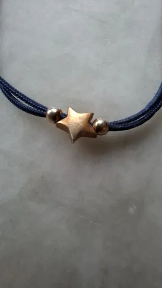Bracciale cordino blu con stella oro