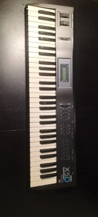 Teclado Korg X5D con funda y pedal