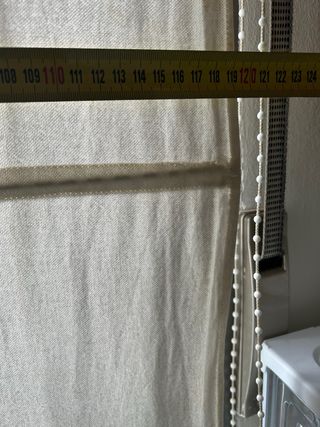 Estor enrollable con sistema