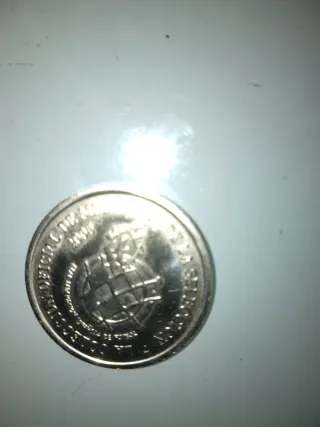 Moneda antigua con retrato de César