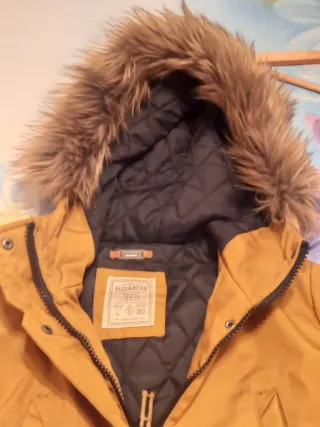 Abrigo mujer color mostaza