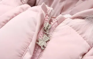 Mono nieve bebé niña rosa con gorro