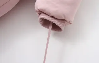 Mono nieve bebé niña rosa con gorro