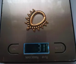 Pesos para dilataciones dorados con púas