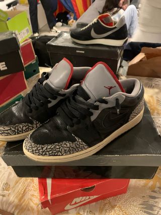 Jordan 1 Low Negro Gris