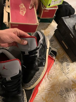 Jordan 1 Low Negro Gris