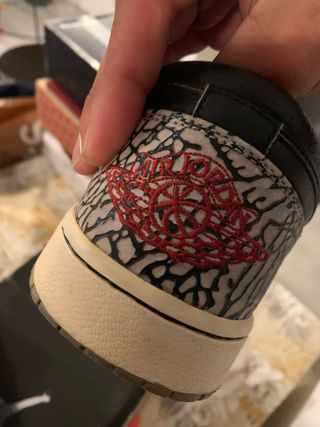 Jordan 1 Low Negro Gris